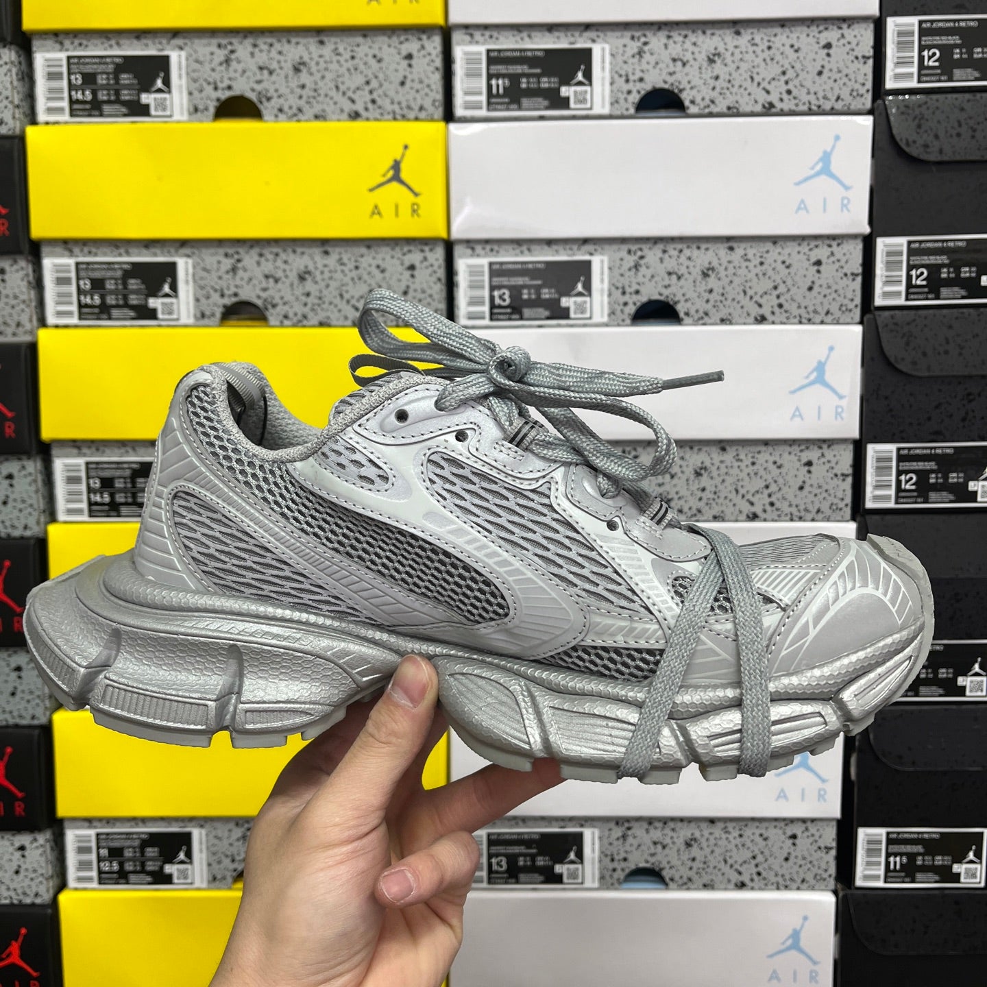 Gray mesh sneaker with lace-up front and chunky cushioned sole