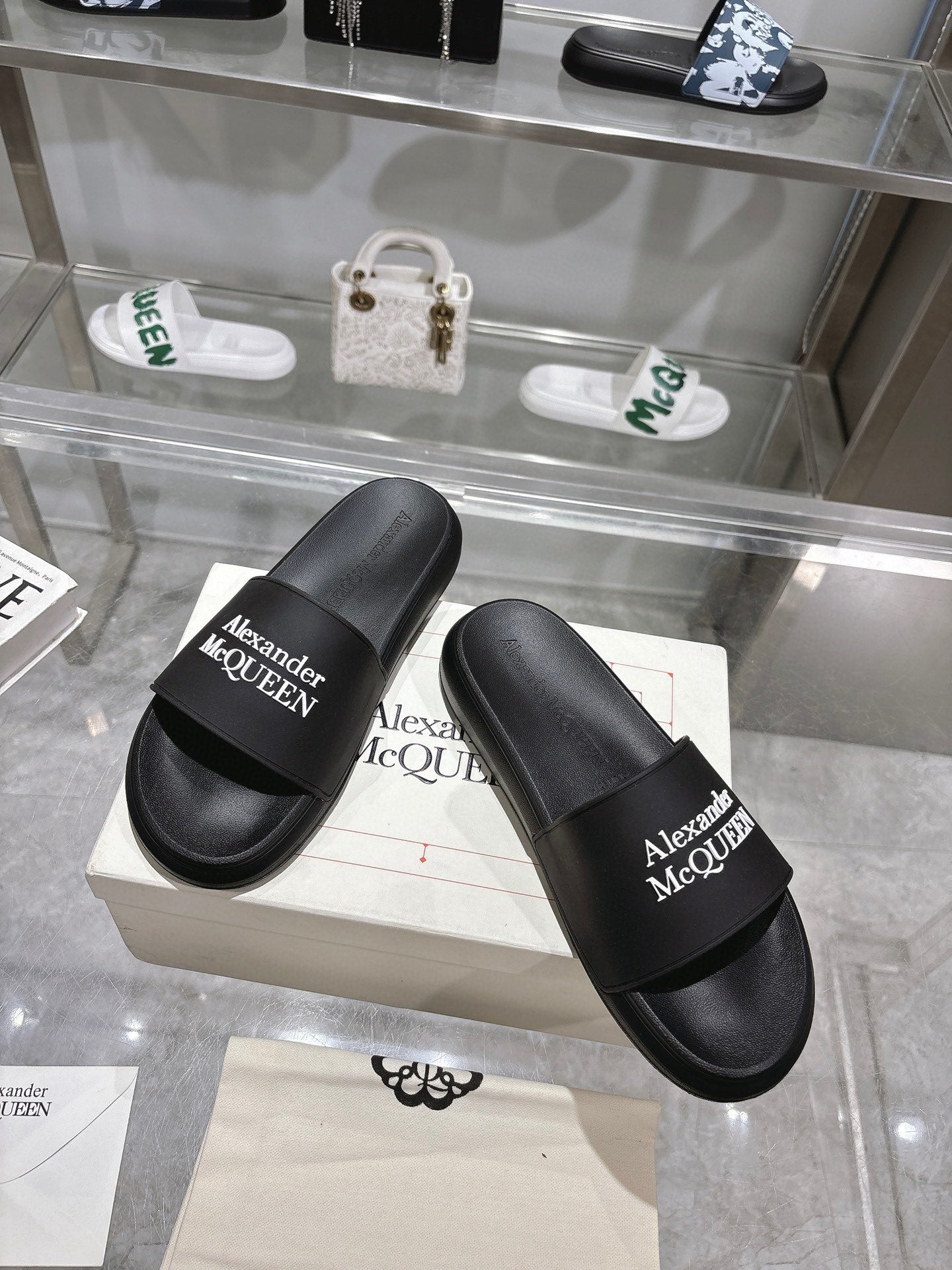 Pair of black Alexander McQUEEN slide sandals with wide logo strap