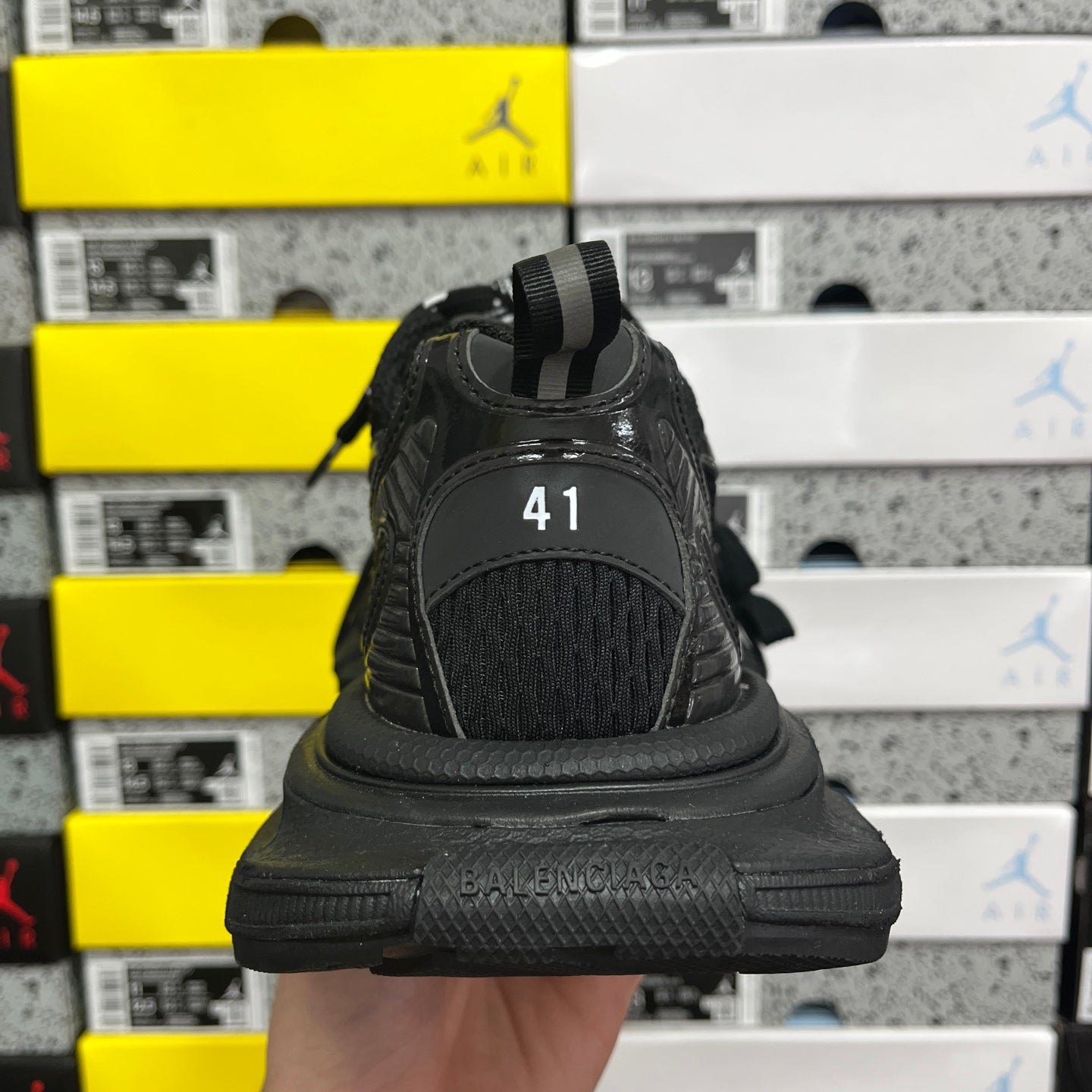 Black Balenciaga sneaker rear view with “41” size mark on heel
