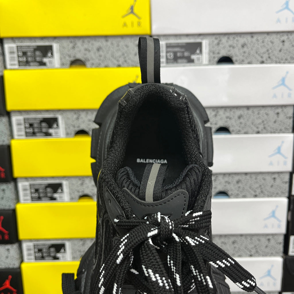 Black Balenciaga sneaker heel with woven pull tab and “BALENCIAGA” text