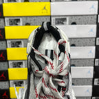 Sneaker tongue and heel view with white laces and black collar padding