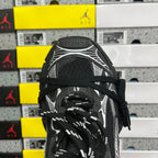 Black sneaker tongue and laces with white ribbed overlay and textured collar