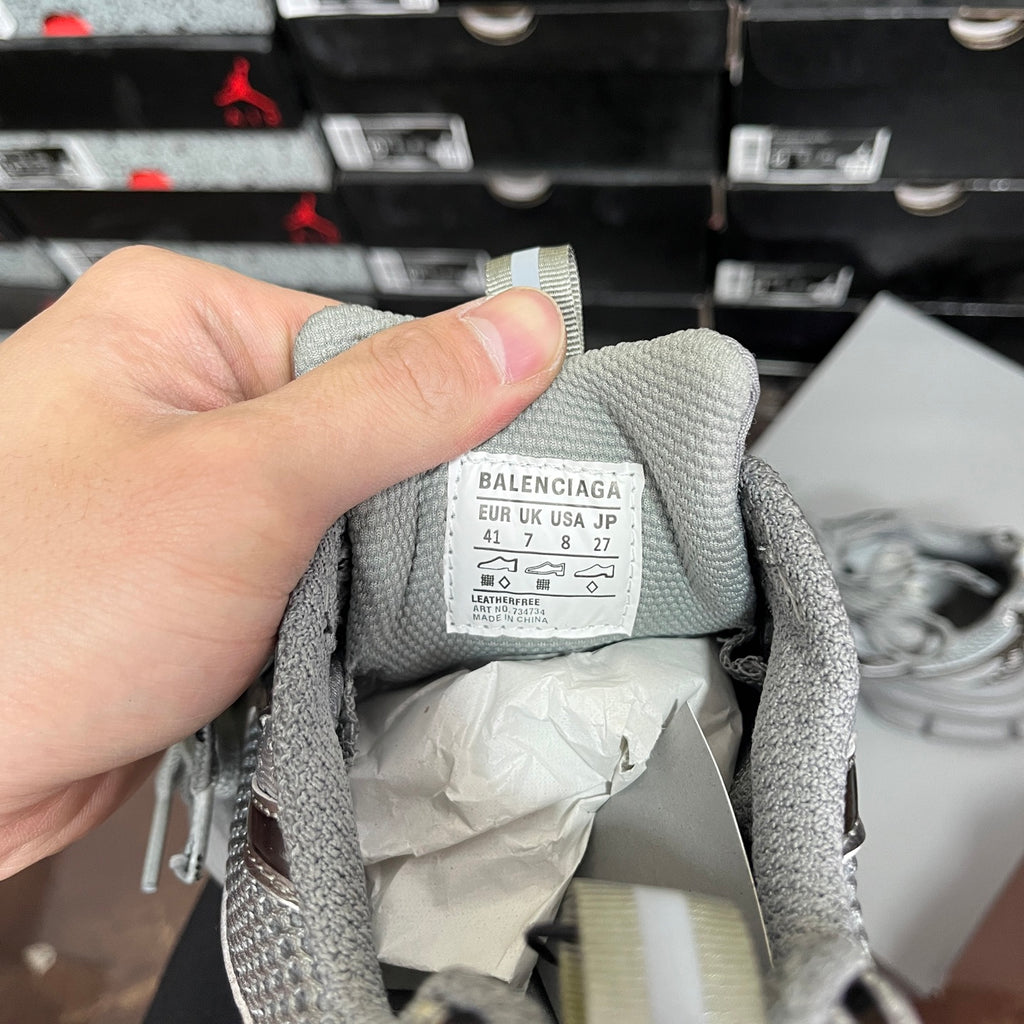 Unisex sneaker tongue tag with BALENCIAGA size and country text on light gray label
