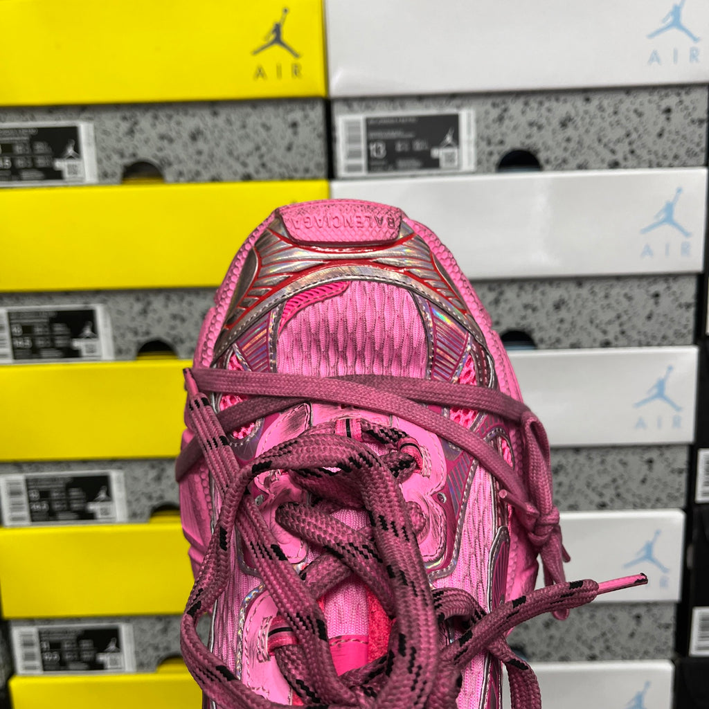 Pink lace-up sneaker toe with braided laces and textured mesh