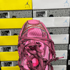 Pink lace-up sneaker toe with braided laces and textured mesh