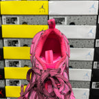 Pink sneaker tongue and interior lining, laces visible
