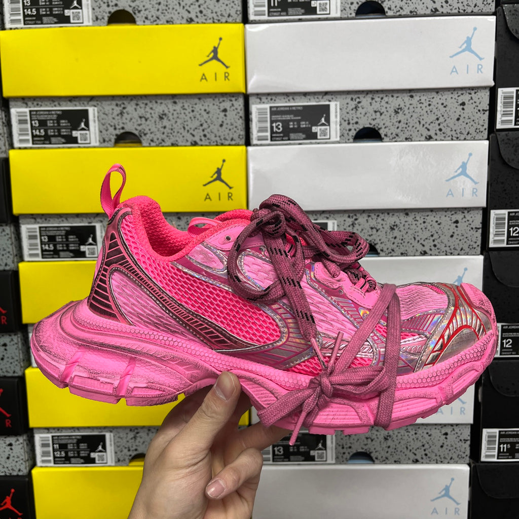 Pink Balenciaga lace-up sneakers with textured mesh upper