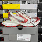 Balenciaga unisex sneaker side view in white and red with white lace-up design