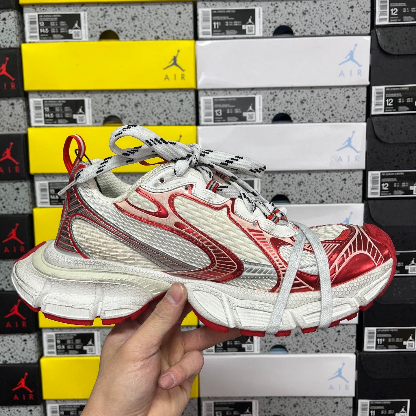 Balenciaga unisex sneaker front and side view in white and red