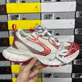 Balenciaga unisex sneaker with white mesh uppers and red side panel details
