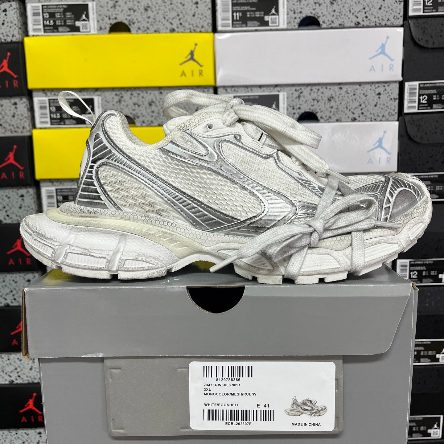Unisex Balenciaga sneakers in silver/white with lace-up front and chunky sole