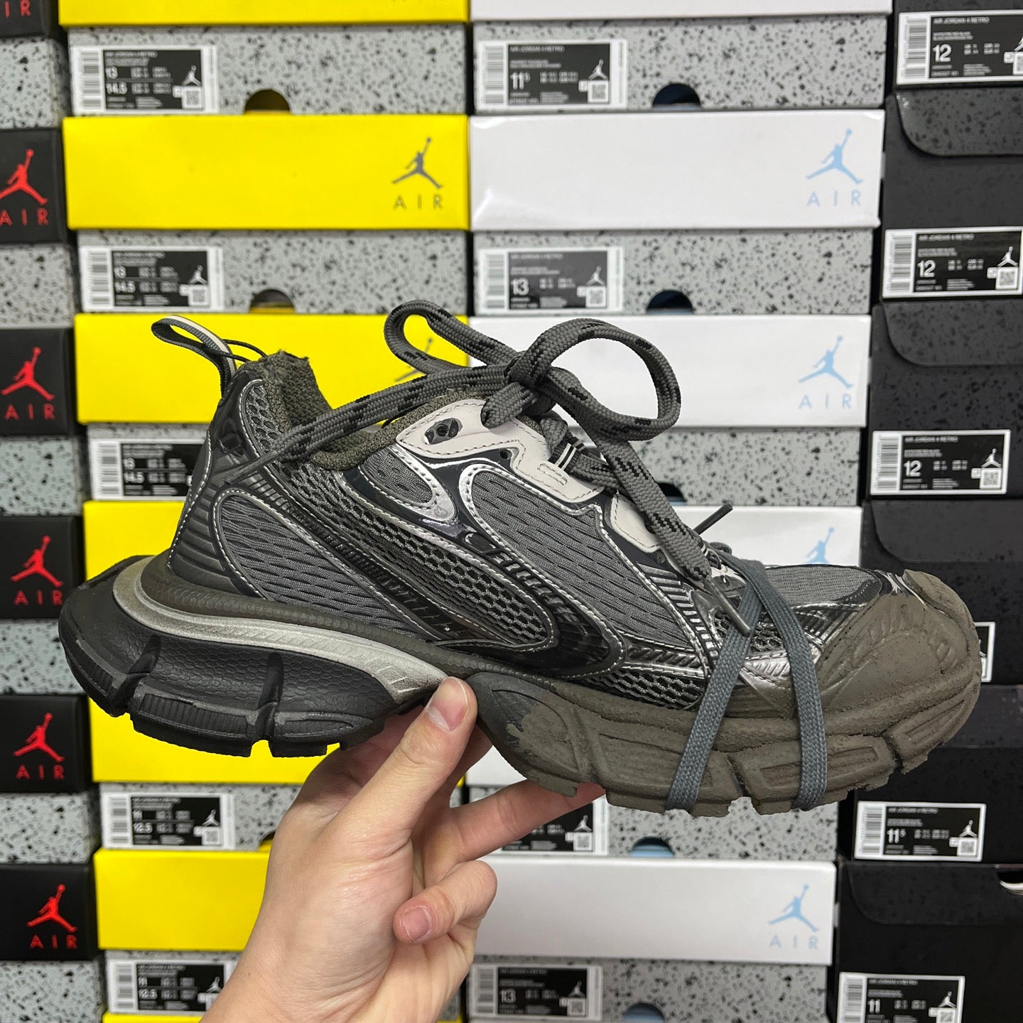 Unisex running sneaker 3/4 front view in gray with lace-up and padded collar