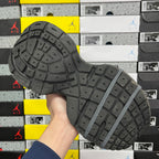 Unisex running sneaker outsole tread in dark gray with traction pattern