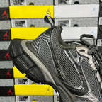 Unisex running sneaker front quarter view with gray mesh and patterned panels