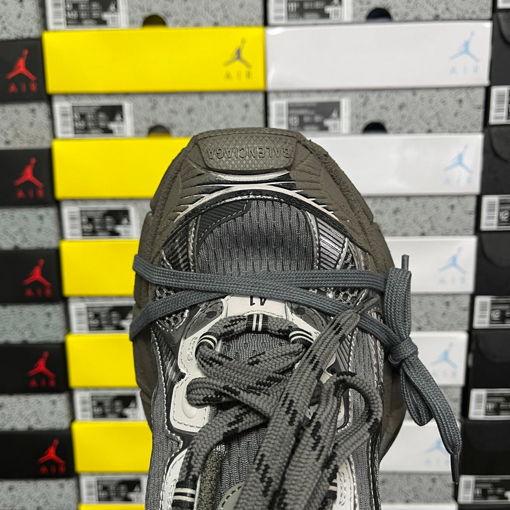 Unisex running sneaker tongue and laces detail with gray fabric and logo patch