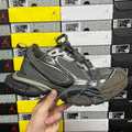 Unisex running sneaker in gray with black mesh panels and lace-up closure