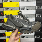 Unisex running sneaker in gray with black mesh panels and lace-up closure