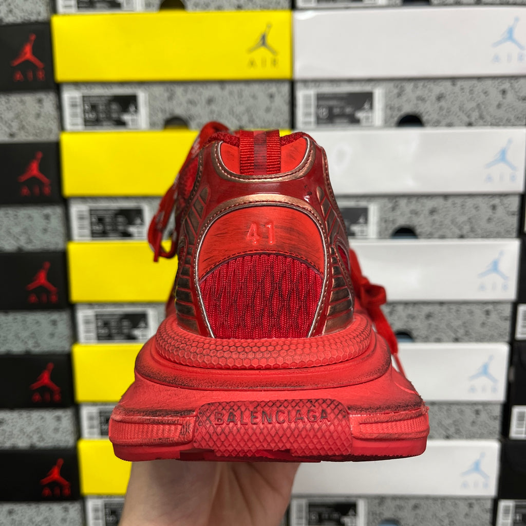 Red Balenciaga sneaker heel with cushioned sole and mesh-textured back panel