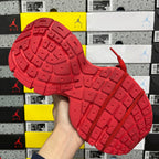 Red sneaker outsole with deep tread pattern and molded traction lines