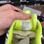 Sneaker interior with neon green lining and BALENCIAGA size label