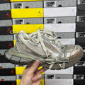 Light gray and metallic silver unisex sneakers with lace-up front and chunky sole