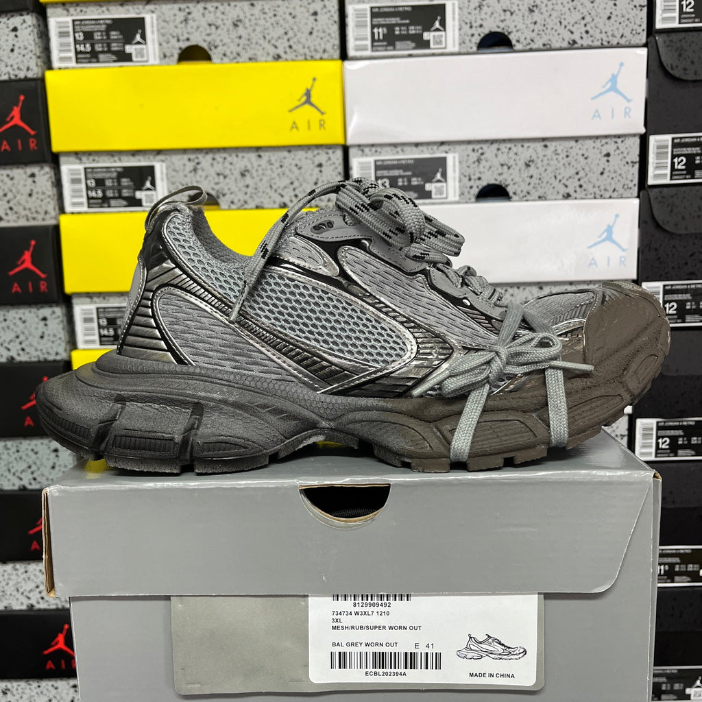 Unisex gray lace-up sneaker on side; chunky sole and mesh upper
