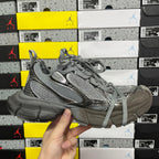 Unisex gray lace-up sneaker side view with chunky sole and textured upper