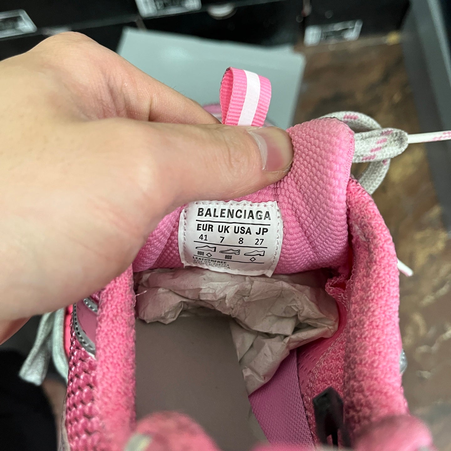 Pink sneaker size label showing Balenciaga, EUR UK USA, 41
