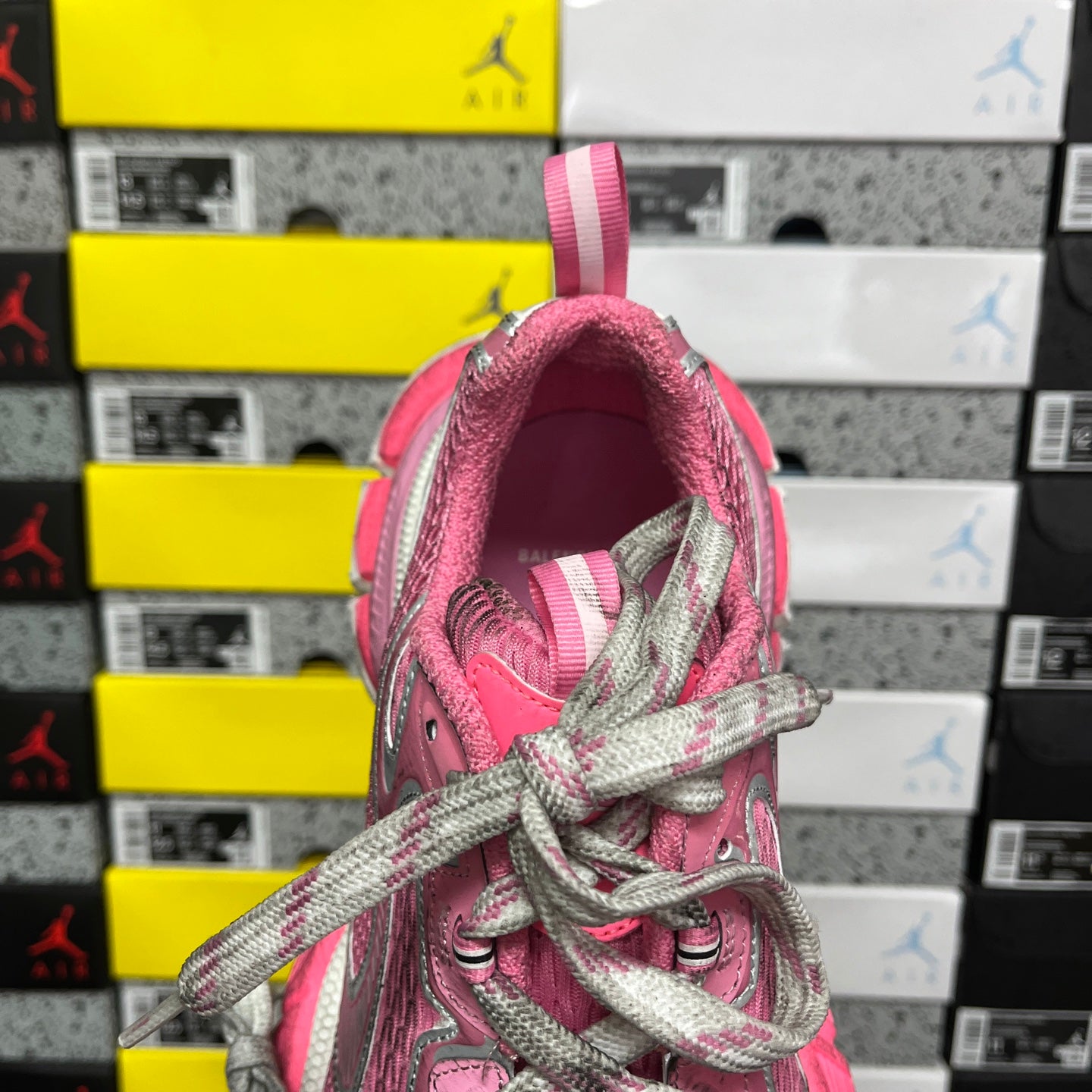 Pink sneaker collar interior with gray laces and pink pull loop detail