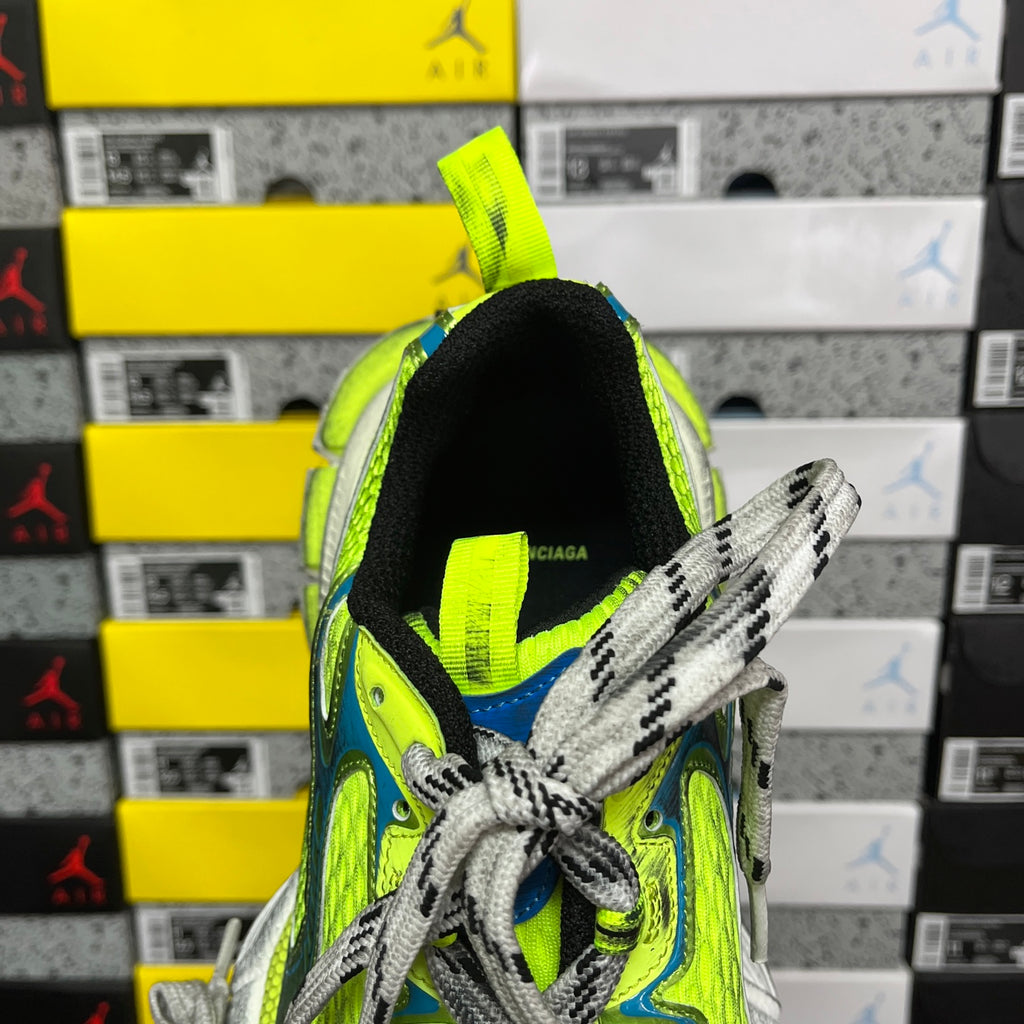 Neon green and blue shoe collar with gray laces and BALENCIAGA text inside