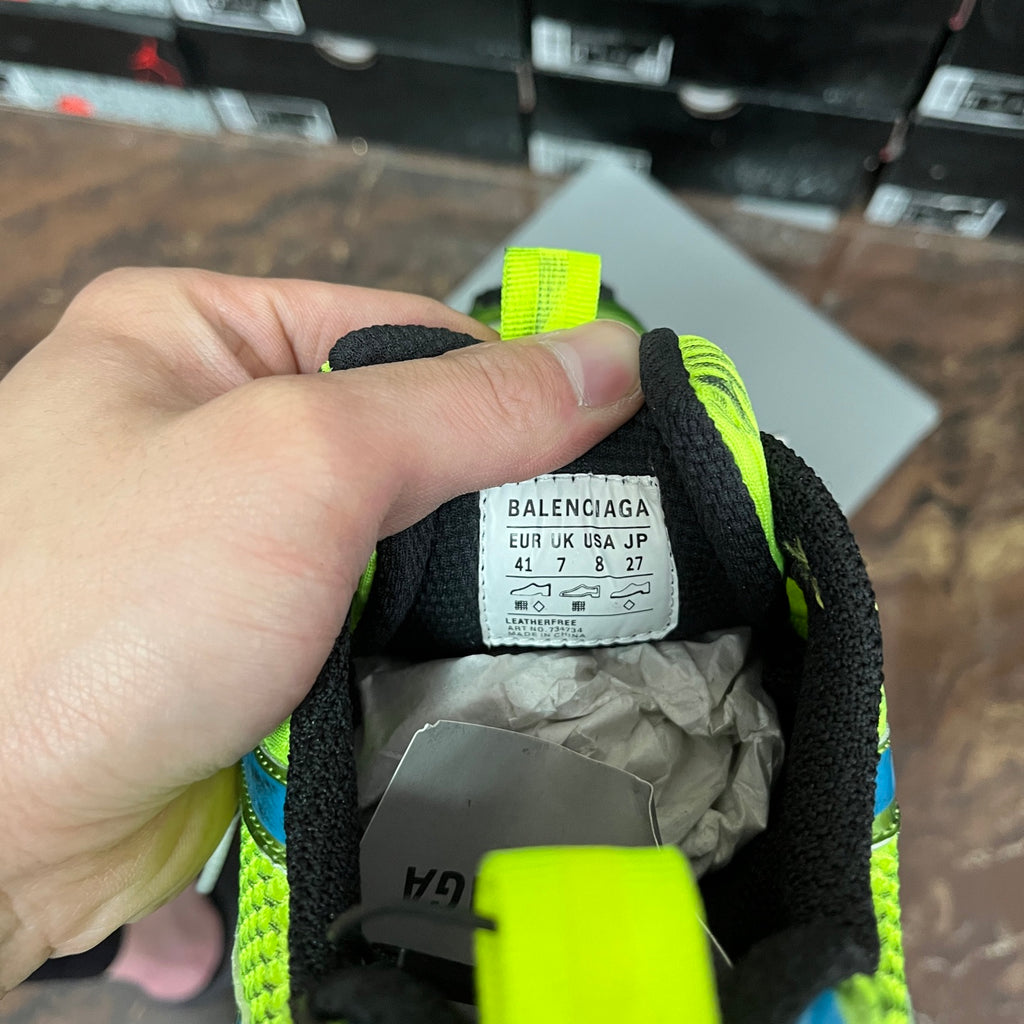 Shoe inside label reading BALENCIAGA with size numbers on neon trim
