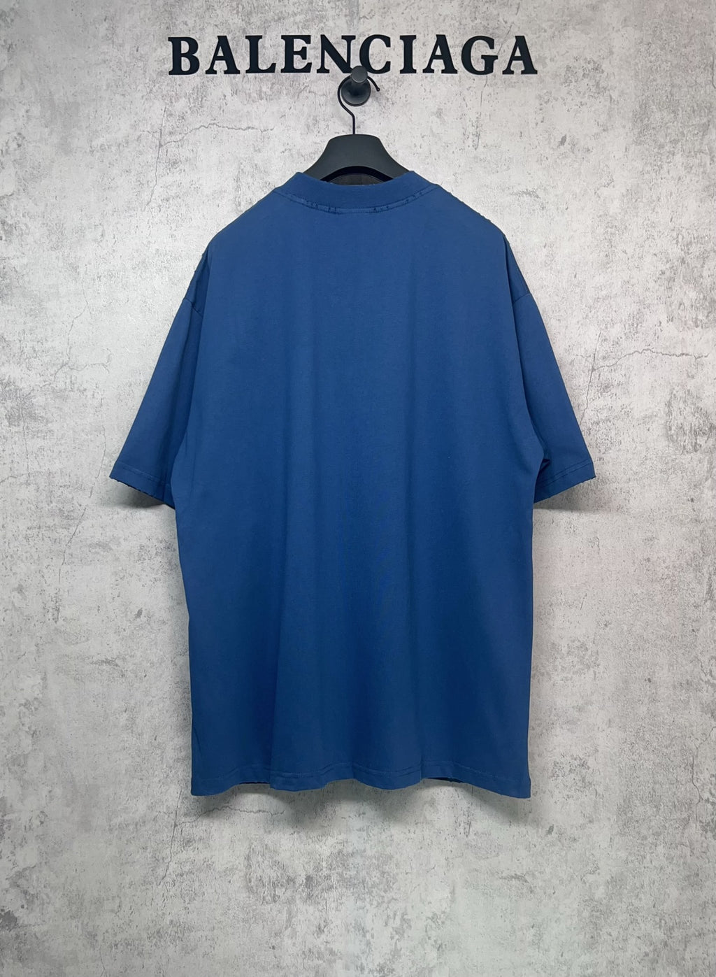 Balenciaga blue oversized T-shirt back view with crew neck and no visible front print