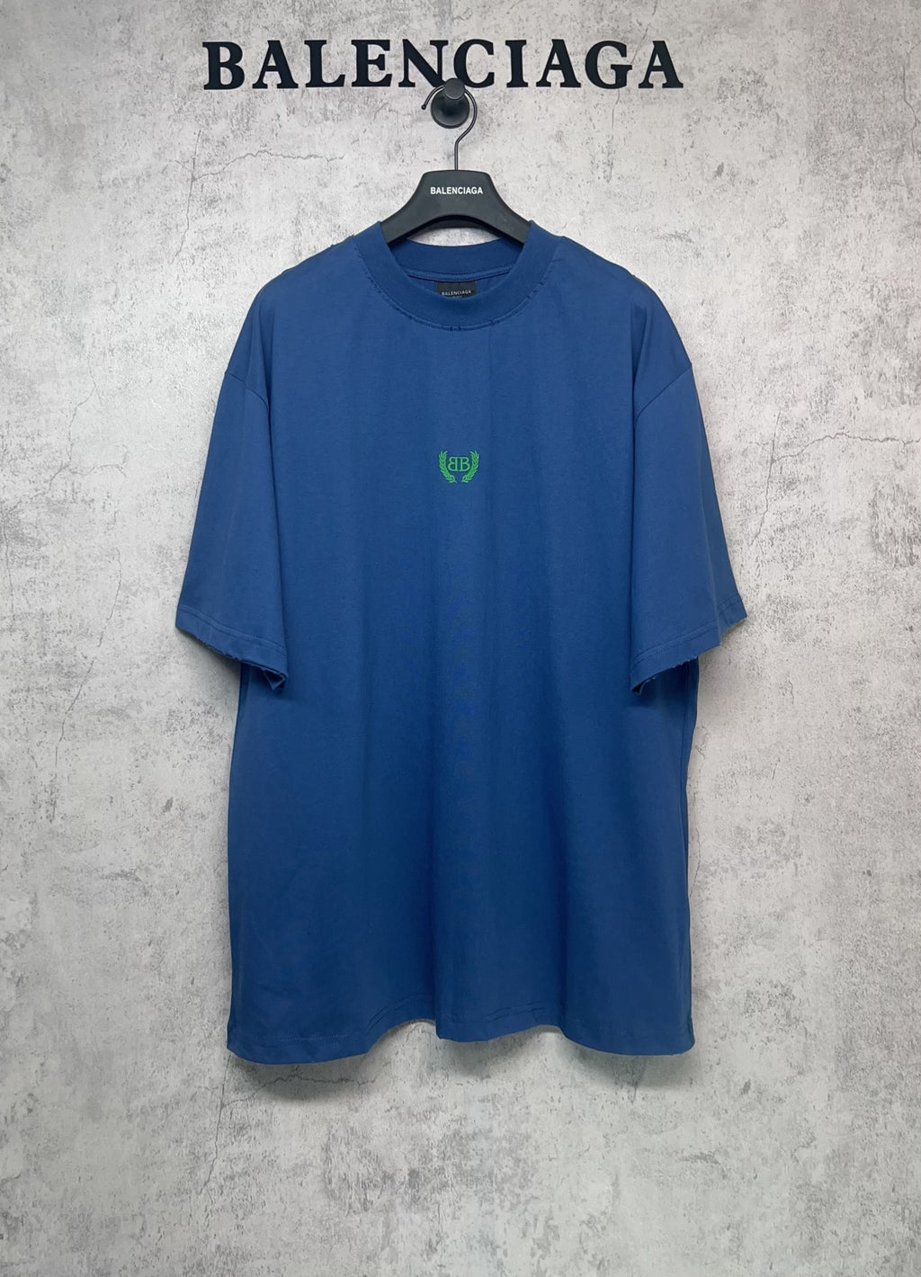 Balenciaga blue oversized T-shirt with crew neck and small green logo at chest