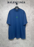 Balenciaga blue oversized T-shirt with crew neck and small green logo at chest