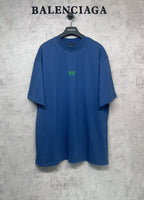 Balenciaga blue oversized T-shirt with crew neck and small green logo at chest