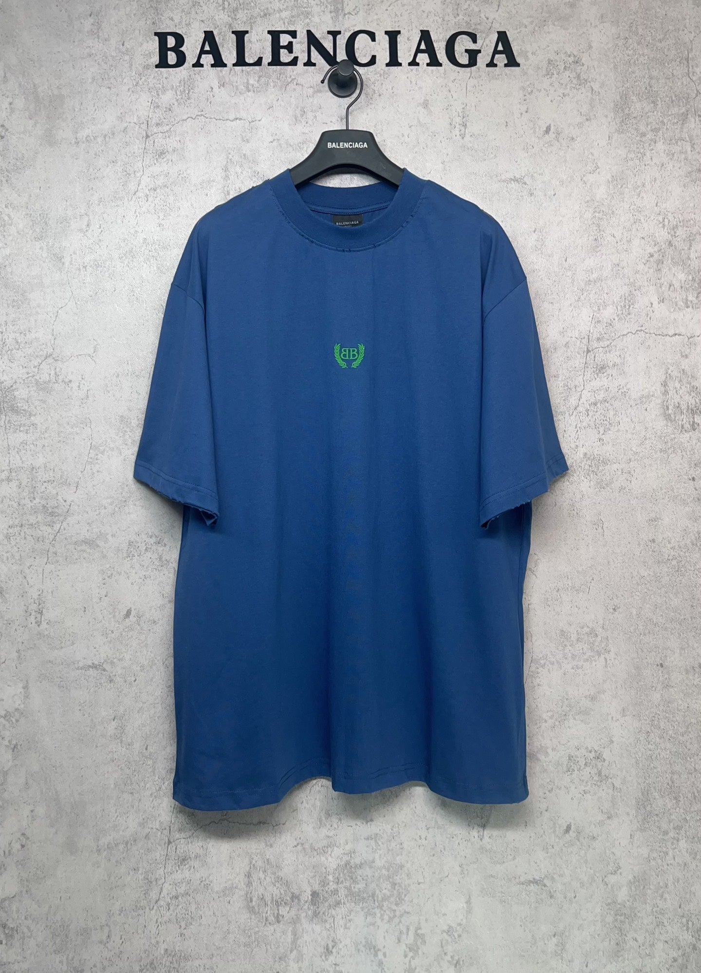 Balenciaga blue oversized T-shirt with crew neck and small green logo at chest