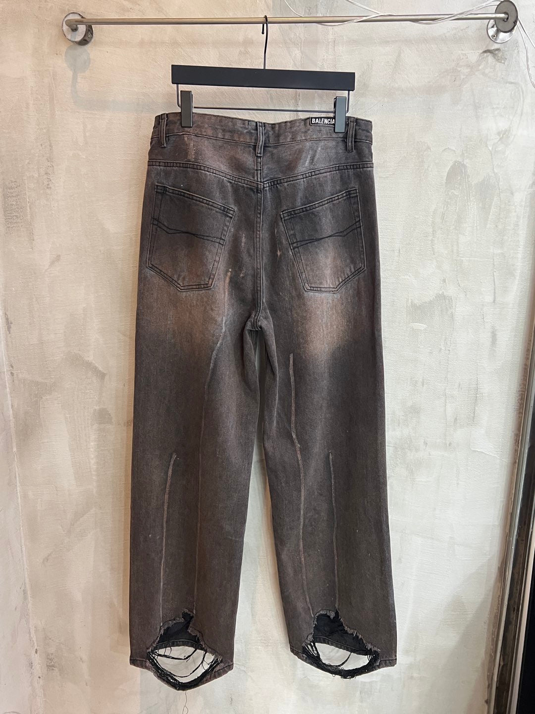 Balenciaga dark gray denim pants with two front pockets, belt loops, and button fly