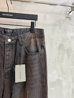 Balenciaga denim pants with front button, belt loops, and hanging size tag