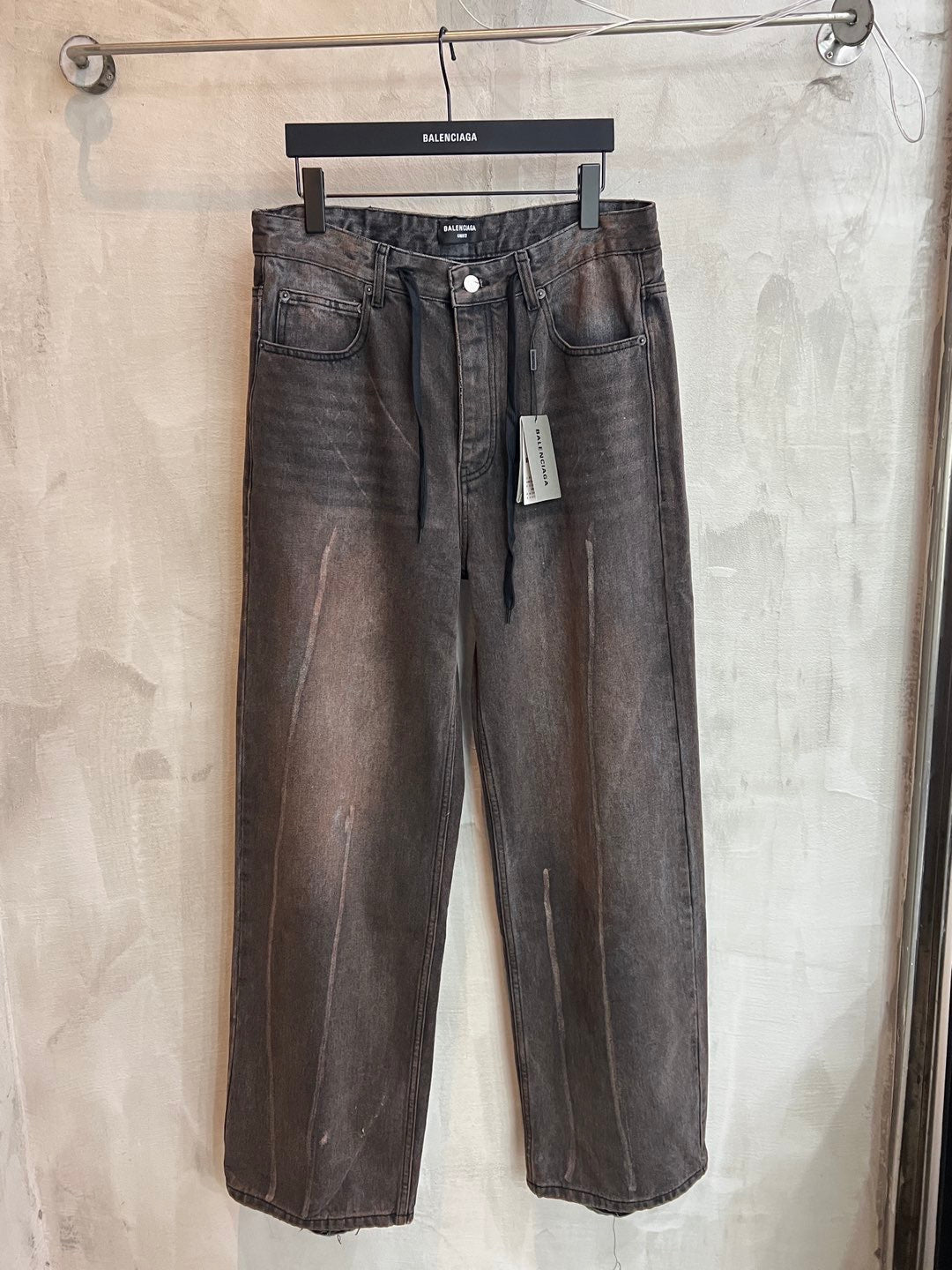 Balenciaga dark gray denim pants with belt loops, button fly, and side pockets