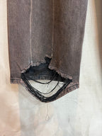 Balenciaga denim pants with frayed ankle cuffs and layered black trim
