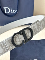 Dior belt angled view, light gray logo strap with black CD buckle.