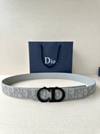 Dior belt with light gray/white logo strap and black CD buckle.