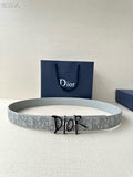 Dior belt in light gray with repeating logo pattern and black-and-gold buckle