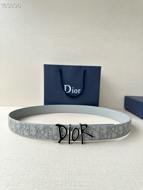 Dior belt in light gray with repeating logo pattern and black-and-gold buckle