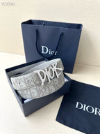 Dior belt with light gray patterned strap and silver-tone Dior buckle