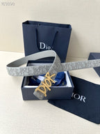 Dior belt on gift box: light gray monogram strap with gold-tone Dior buckle