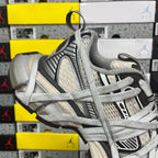 Unisex sneakers side and heel with gray knit collar and textured striped overlays