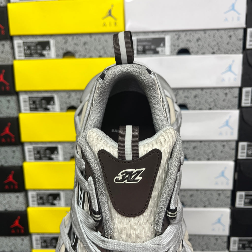 Unisex sneakers back view with gray mesh collar and leather heel logo patch