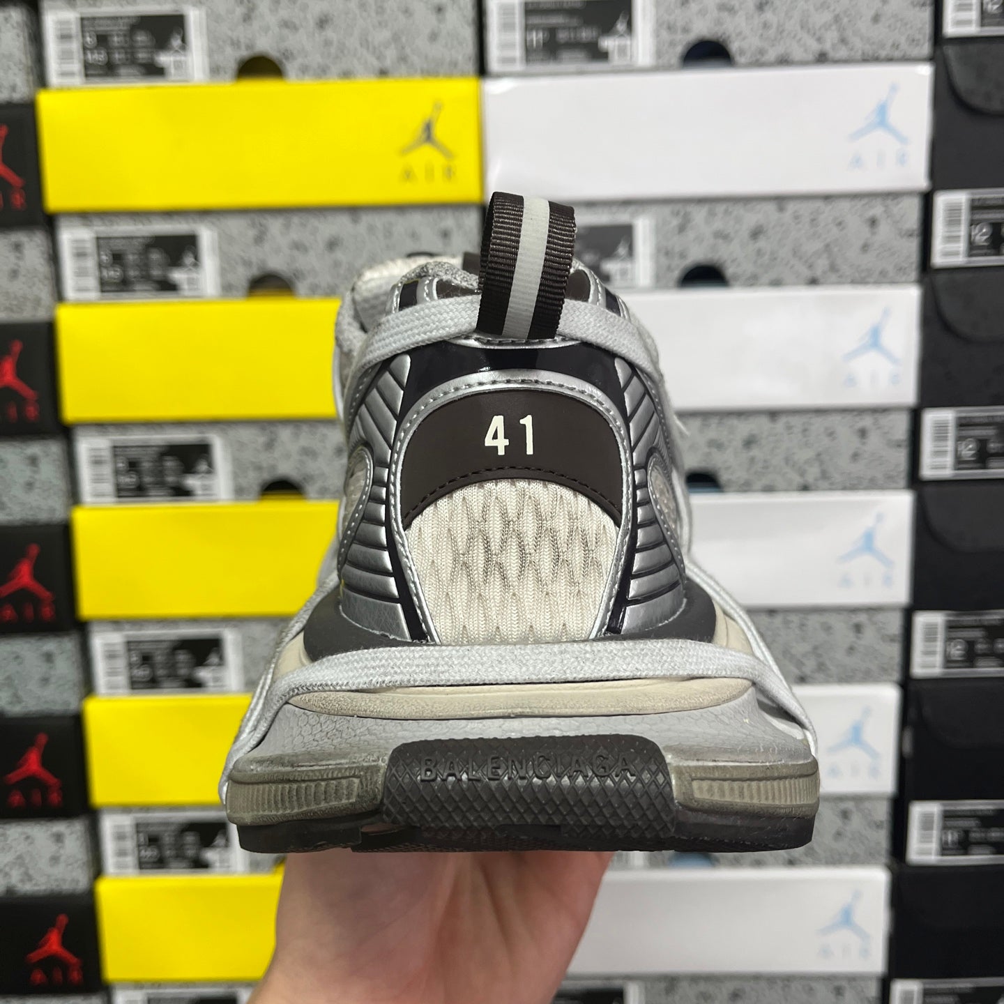 Unisex sneakers rear view with mesh back panel, contrast trim, and size marker