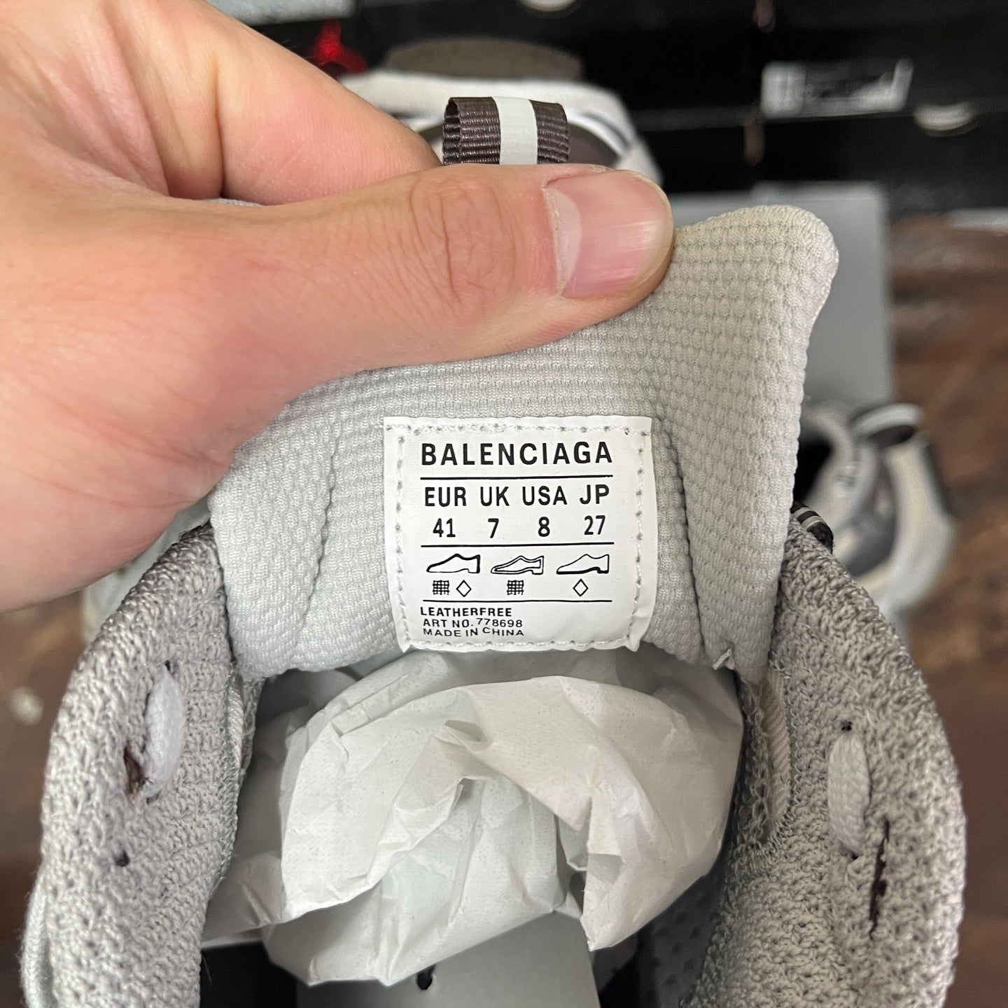 Unisex sneakers interior size label on gray fabric lining, showing BALENCIAGA